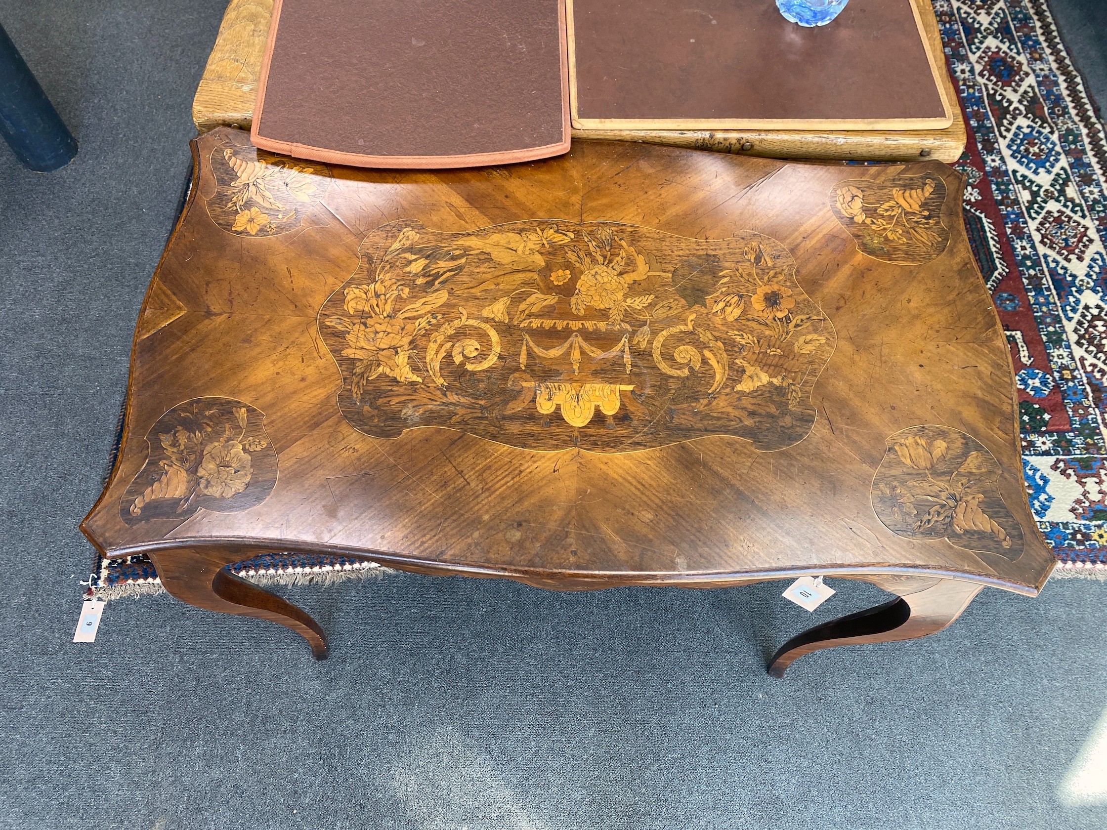 A Victorian walnut and marquetry inlaid rectangular serpentine centre table, width 90cm, depth 52cm, height 75cm